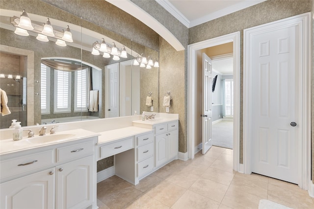 full bathroom featuring double vanity, ornamental molding, a sink, and wallpapered walls