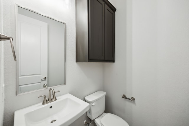 bathroom featuring a sink and toilet