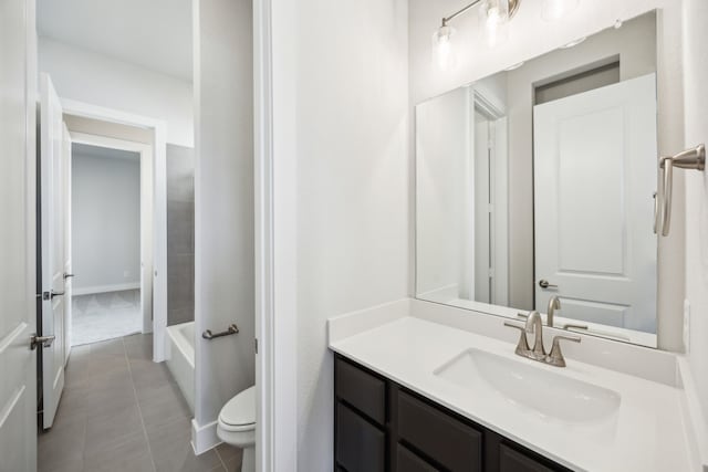 full bath featuring vanity, tile patterned flooring, and toilet