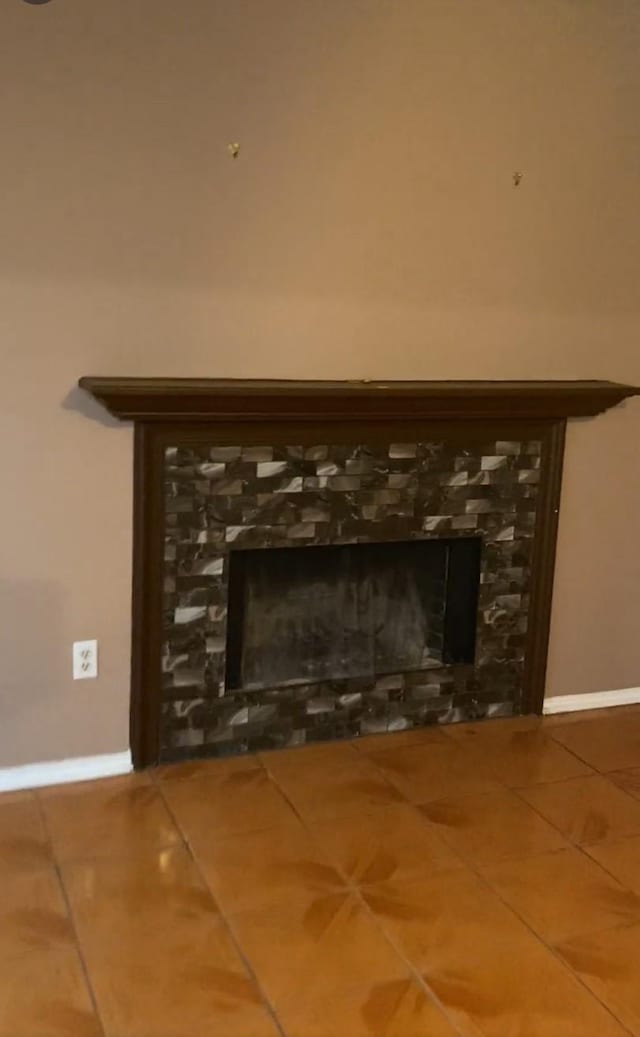 room details with a fireplace and baseboards