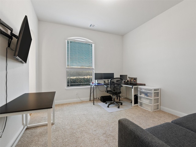 carpeted home office featuring baseboards and visible vents