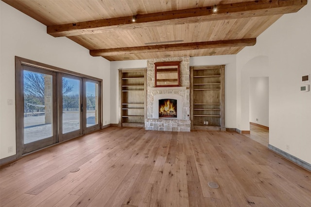 unfurnished living room with wood ceiling, baseboards, a fireplace, and light wood finished floors