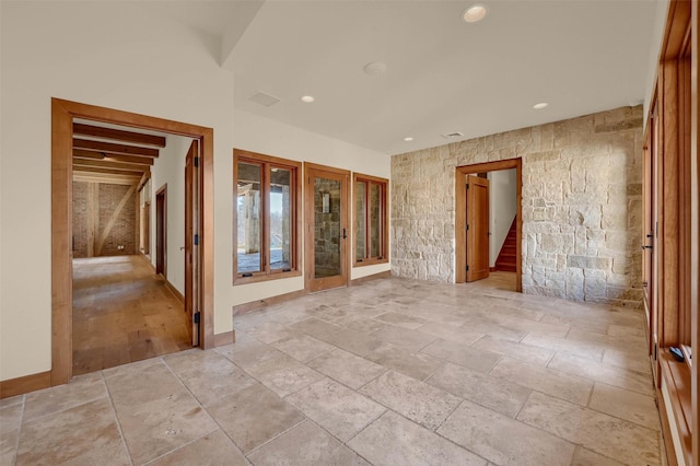 unfurnished room with stairs and recessed lighting