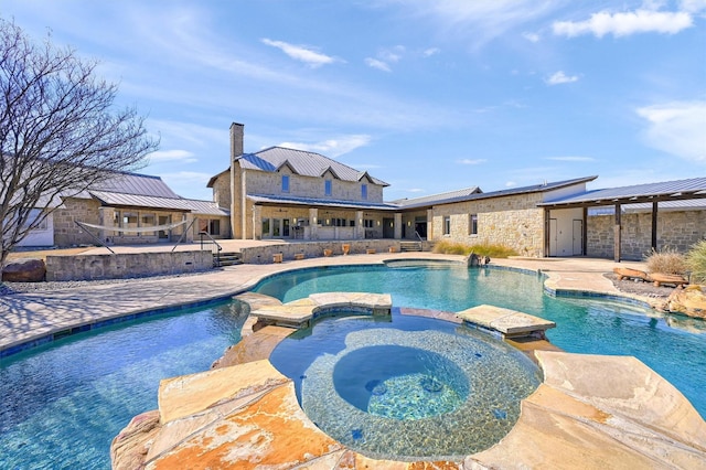 view of swimming pool featuring a patio area and a pool with connected hot tub