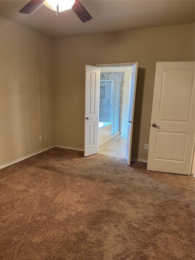 unfurnished room featuring light carpet, baseboards, and a ceiling fan