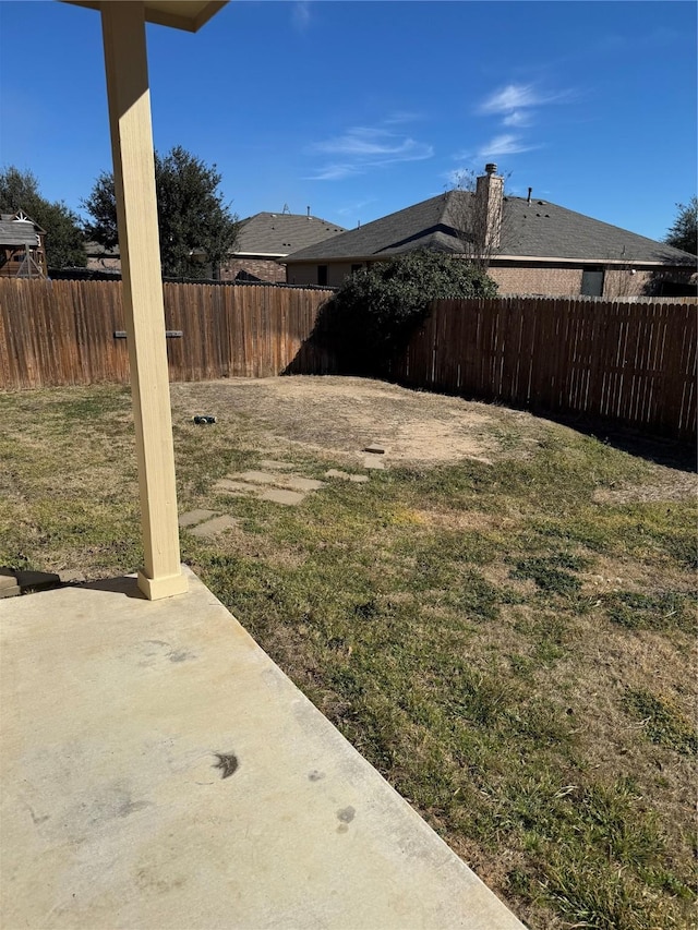 view of yard with a fenced backyard and a patio