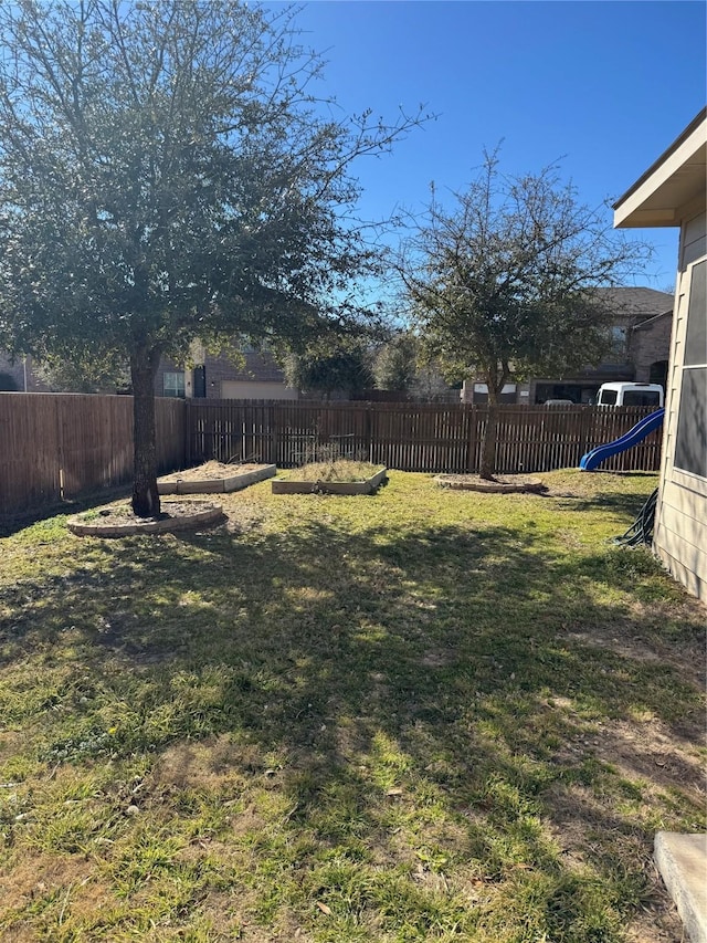 view of yard with a fenced backyard