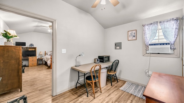 office space with lofted ceiling, light wood-style floors, ceiling fan, cooling unit, and electric panel