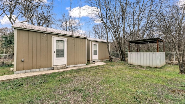 view of shed featuring fence