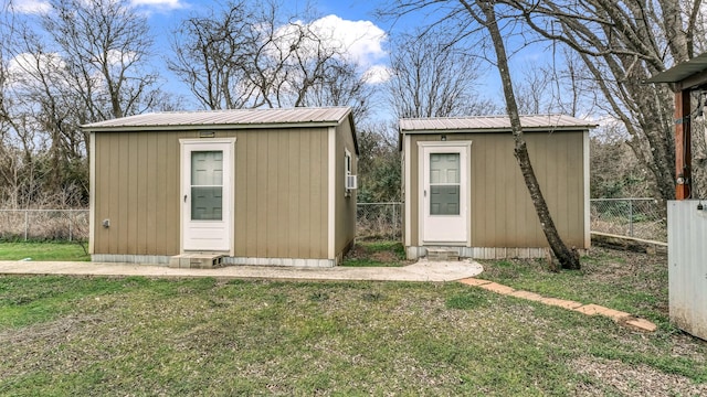 view of shed with a fenced backyard