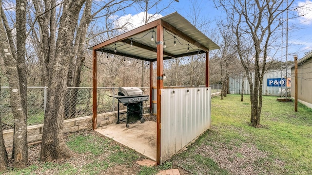 view of yard featuring a detached carport and fence