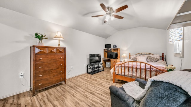 bedroom with light wood-type flooring, lofted ceiling, and baseboards