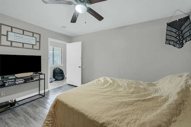 bedroom featuring ceiling fan and wood finished floors