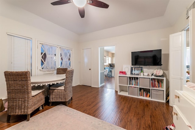 dining space with dark wood finished floors and a ceiling fan