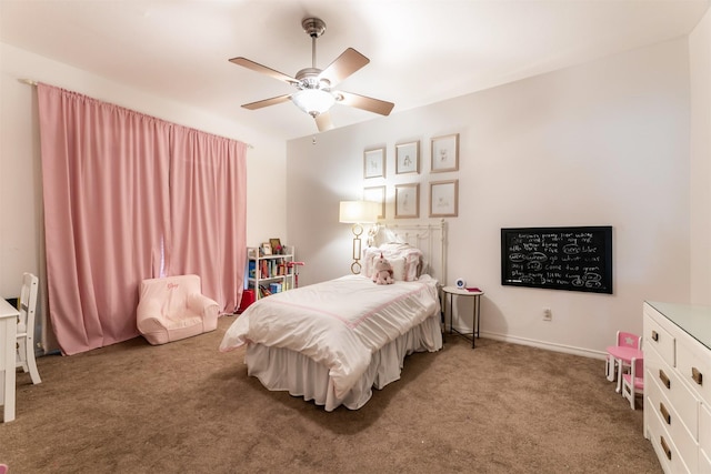 carpeted bedroom with ceiling fan and baseboards