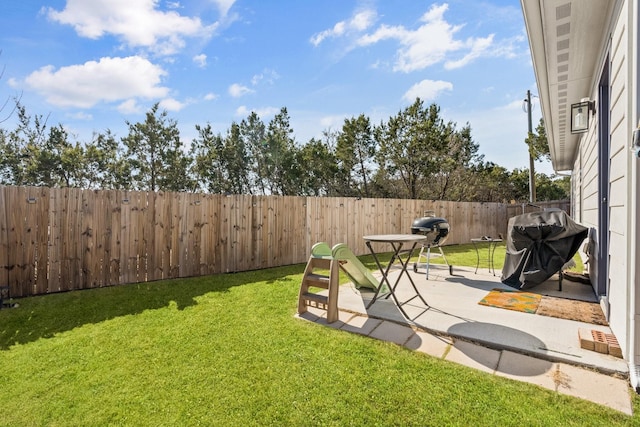 view of yard with a patio and a fenced backyard