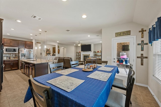 dining room featuring a fireplace, recessed lighting, visible vents, a ceiling fan, and light tile patterned flooring