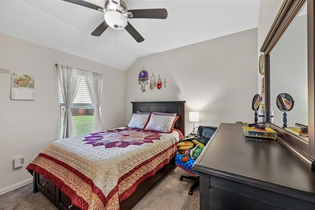 bedroom with a ceiling fan, carpet flooring, vaulted ceiling, and baseboards