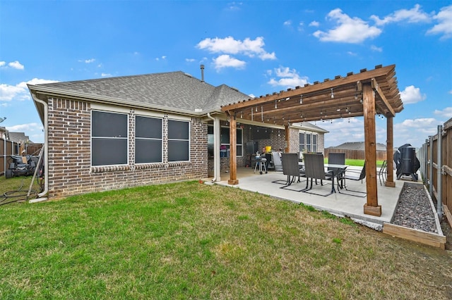 back of house with a patio, a fenced backyard, brick siding, a lawn, and a pergola