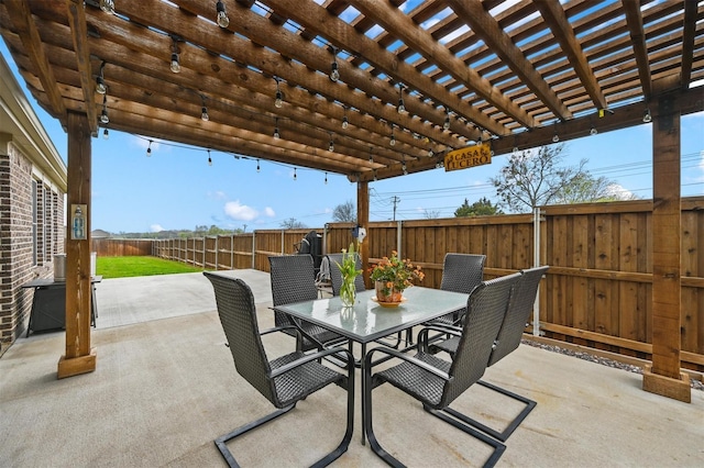 view of patio with outdoor dining area, a fenced backyard, and a pergola