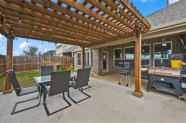 view of patio / terrace featuring outdoor dining area, fence, and a pergola