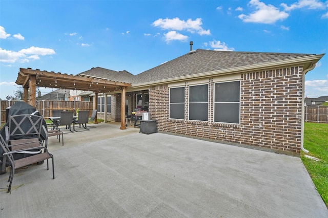 view of patio featuring fence and a pergola