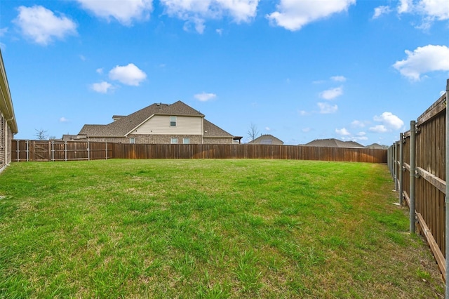 view of yard featuring a fenced backyard