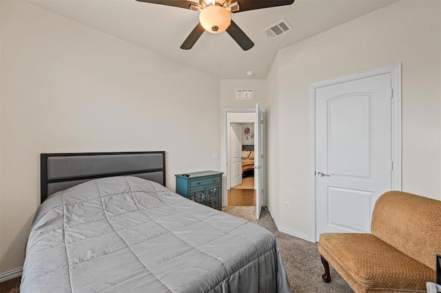 bedroom featuring a ceiling fan, visible vents, light carpet, and baseboards