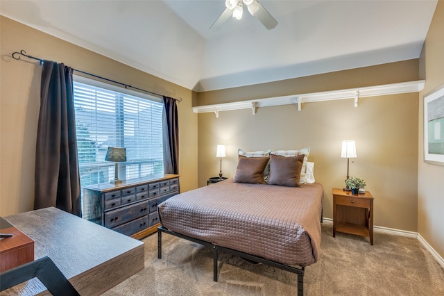 bedroom featuring light carpet, lofted ceiling, a ceiling fan, and baseboards