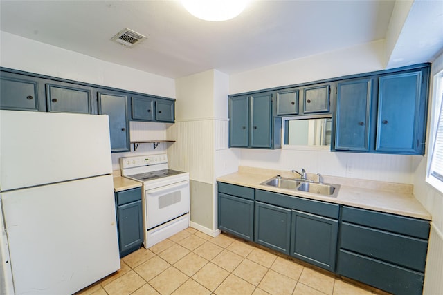 kitchen with light countertops, white appliances, a sink, and blue cabinets