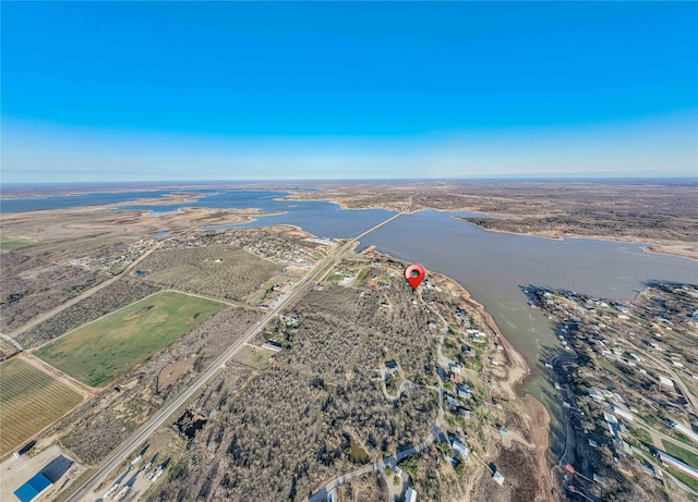 birds eye view of property featuring a water view and a rural view