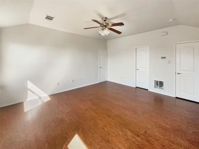 spare room with vaulted ceiling, visible vents, and a ceiling fan