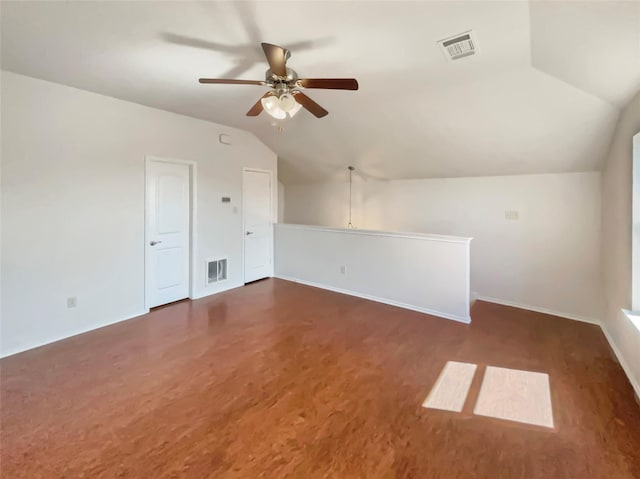 bonus room with dark wood-type flooring, visible vents, vaulted ceiling, and a ceiling fan