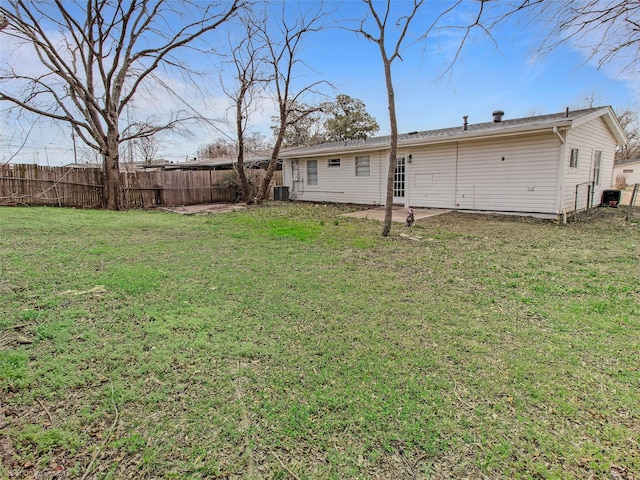 view of yard featuring a patio area, cooling unit, and fence