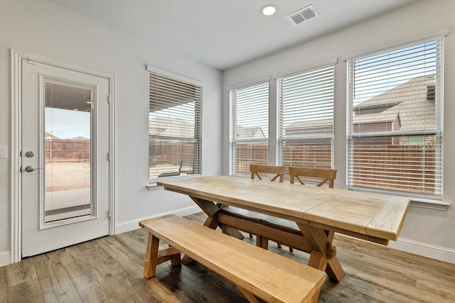 dining space with light wood-style flooring, visible vents, baseboards, and recessed lighting