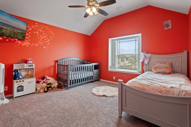 bedroom featuring baseboards, visible vents, a ceiling fan, lofted ceiling, and carpet floors