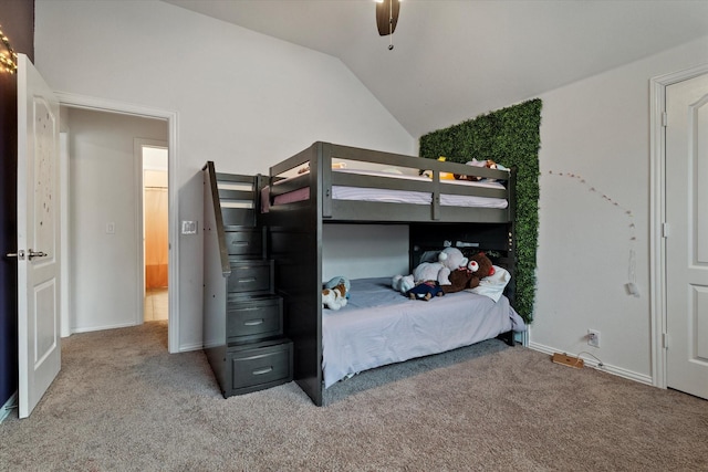 bedroom with carpet floors, vaulted ceiling, baseboards, and a ceiling fan