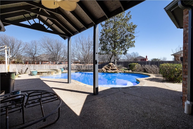 view of pool with a patio area, a fenced backyard, and a fenced in pool