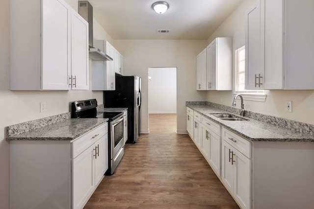 kitchen with white cabinets, visible vents, stainless steel appliances, and a sink