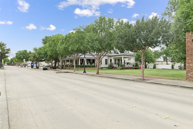 view of road featuring sidewalks and curbs