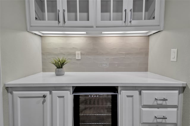 bar with wine cooler and decorative backsplash