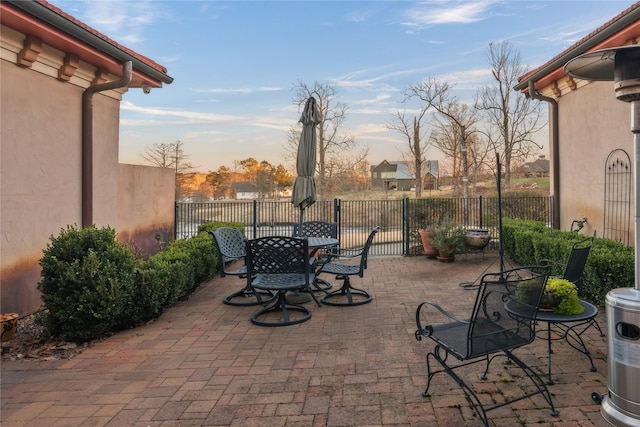 view of patio / terrace with outdoor dining area and fence