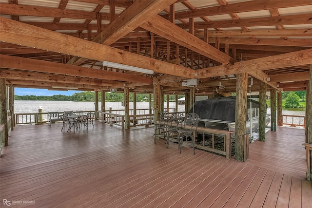 deck with a boat dock, a water view, and boat lift