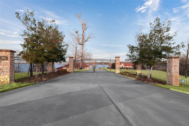 view of gate with fence