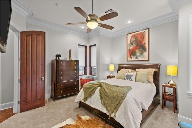 bedroom with baseboards, visible vents, light colored carpet, and ornamental molding