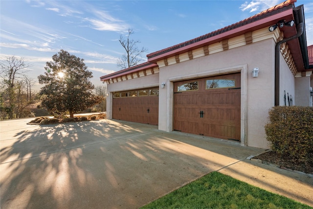 garage featuring driveway