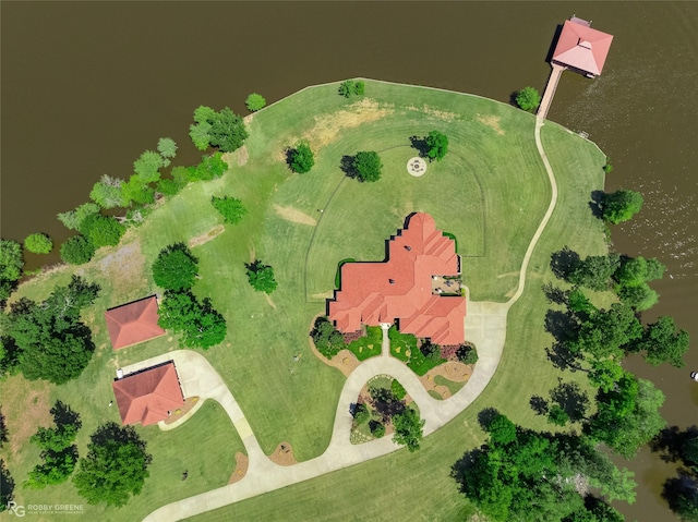 birds eye view of property with a water view