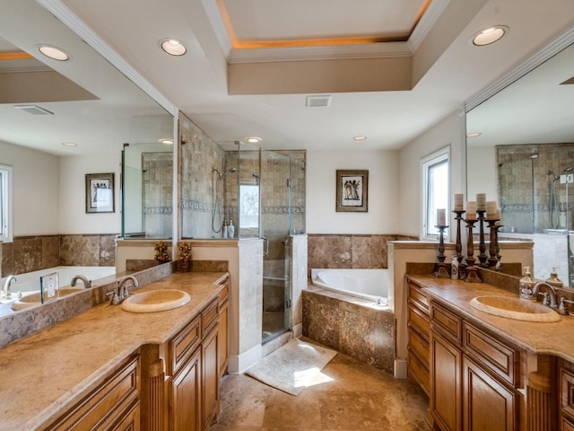 full bathroom featuring a sink, a stall shower, and crown molding