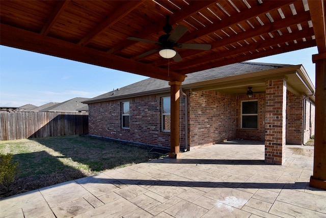 view of patio / terrace featuring fence and a ceiling fan