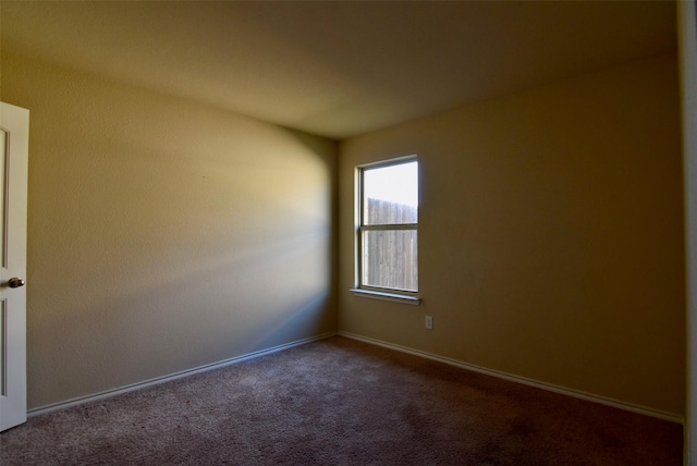 spare room with carpet floors and baseboards